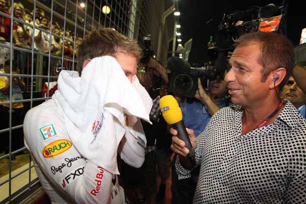 Kai Ebel mit Sebastian Vettel in Singapur