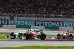 Foto zur News: Adrian Sutil (Force India) und Lewis Hamilton (McLaren)