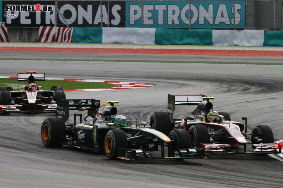 Foto zur News: Heikki Kovalainen (Lotus) und Bruno Senna (HRT)