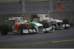 Foto zur News: Adrian Sutil (Force India) und Kamui Kobayashi (Sauber)