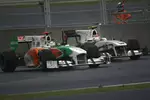 Foto zur News: Adrian Sutil (Force India) und Kamui Kobayashi (Sauber)