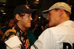 Foto zur News: Sebastian Vettel (Red Bull) und Michael Schumacher (Mercedes)