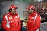 Foto zur News: Fernando Alonso und Marc Gene (Ferrari)