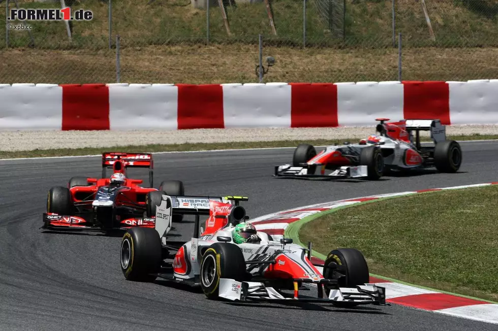 Foto zur News: Vitantonio Liuzzi (HRT) und Timo Glock (Marussia-Virgin)