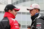 Foto zur News: Timo Glock (Marussia-Virgin) und Michael Schumacher (Mercedes)