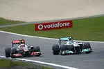 Foto zur News: Jenson Button (McLaren) und Nico Rosberg (Mercedes)