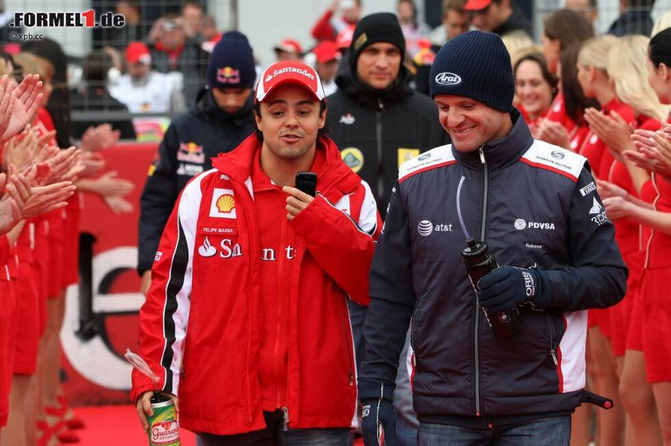 Foto zur News: Felipe Massa (Ferrari) und Rubens Barrichello (Williams)