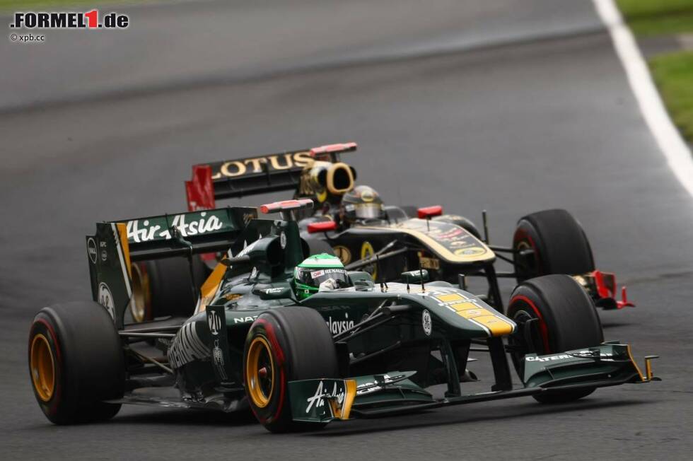 Foto zur News: Heikki Kovalainen (Lotus) und Nick Heidfeld (Renault)