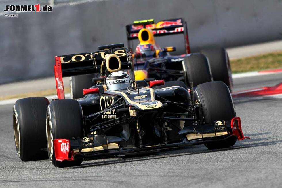 Foto zur News: Kimi Räikkönen (Lotus) Mark Webber (Red Bull)