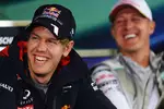 Foto zur News: Sebastian Vettel (Red Bull) und Michael Schumacher (Mercedes)