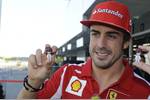 Foto zur News: Fernando Alonso (Ferrari) macht Werbung für ein japanisches Videospiel