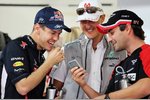 Foto zur News: Sebastian Vettel (Red Bull), Michael Schumacher (Mercedes) und Timo Glock (Marussia)