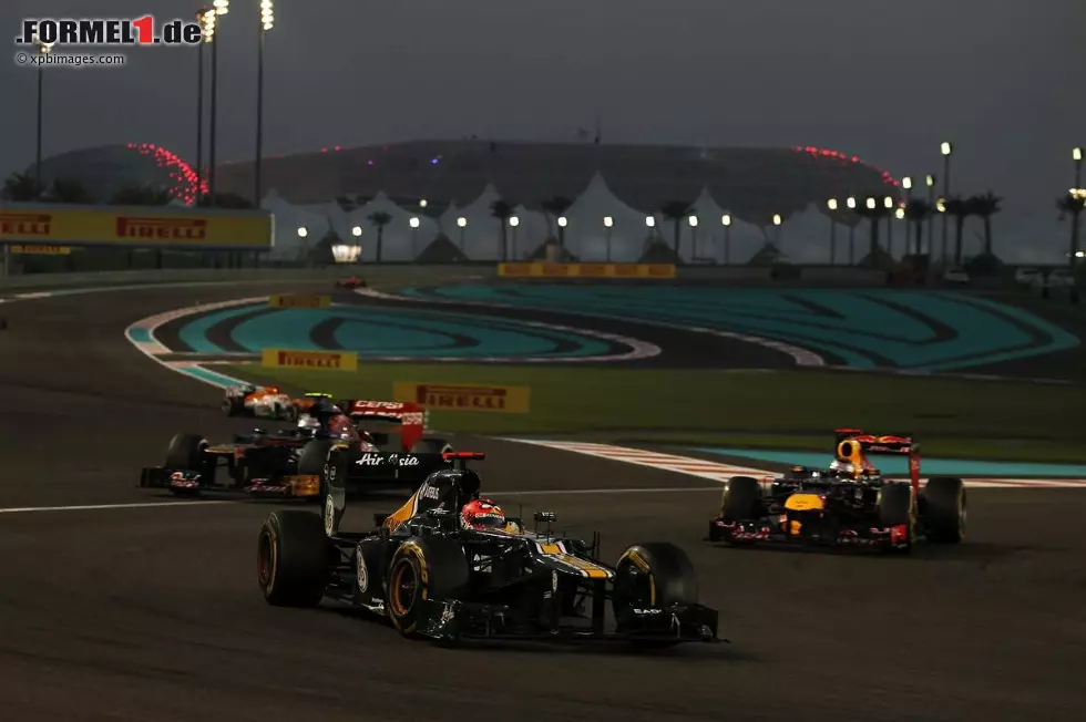 Foto zur News: Heikki Kovalainen (Caterham), Jean-Eric Vergne (Toro Rosso) und Sebastian Vettel (Red Bull)