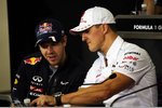 Foto zur News: Sebastian Vettel (Red Bull) und Michael Schumacher (Mercedes)
