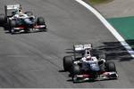 Foto zur News: Kamui Kobayashi (Sauber) und Sergio Perez (Sauber)