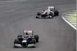 Foto zur News: Bruno Senna (Williams) und Sergio Perez (Sauber)