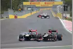 Foto zur News: Daniel Ricciardo (Toro Rosso) und Kimi Räikkönen (Lotus)