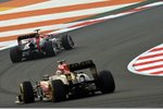 Foto zur News: Mark Webber (Red Bull) und Kimi Räikkönen (Lotus)