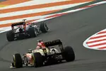 Foto zur News: Mark Webber (Red Bull) und Kimi Räikkönen (Lotus)