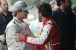 Foto zur News: Fernando Alonso (Ferrari) und Nico Rosberg (Mercedes)