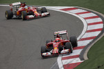 Foto zur News: Kimi Räikkönen (Ferrari) und Fernando Alonso (Ferrari)