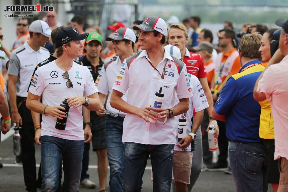 Foto zur News: Nico Rosberg (Mercedes) und Adrian Sutil (Sauber)