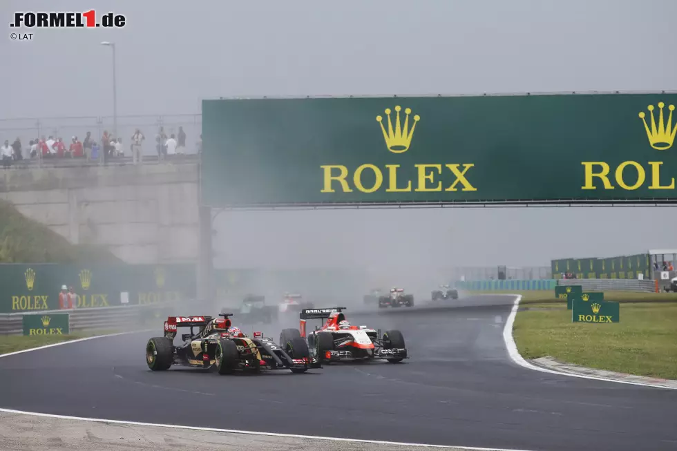 Foto zur News: Romain Grosjean (Lotus) und Jules Bianchi (Marussia)