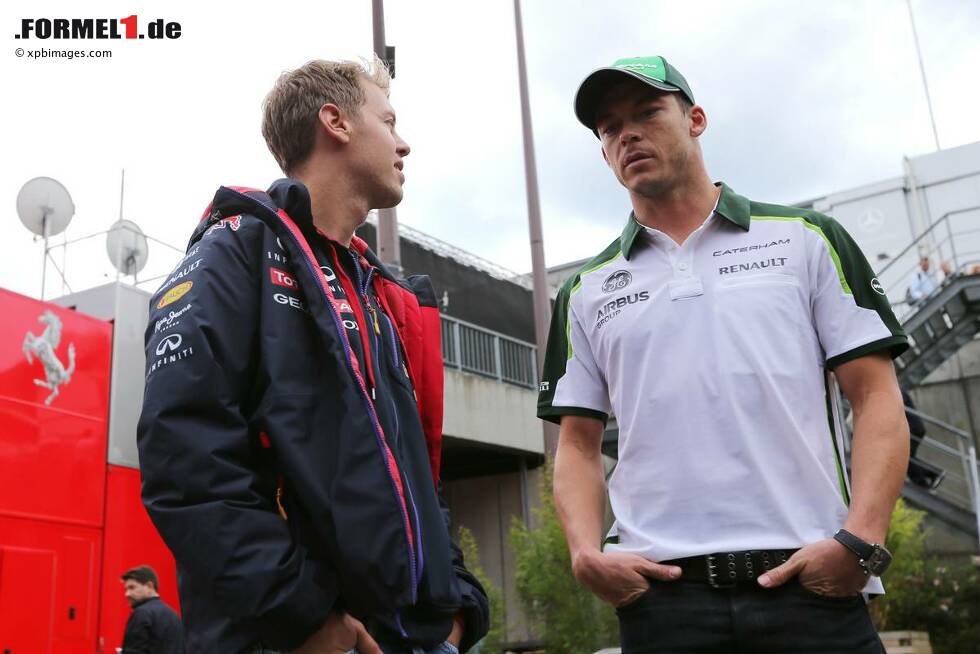 Foto zur News: Sebastian Vettel (Red Bull) und Andre Lotterer