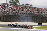 Foto zur News: Fernando Alonso (Ferrari) und Adrian Sutil (Sauber)