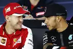 Foto zur News: Sebastian Vettel (Ferrari) und Lewis Hamilton (Mercedes)