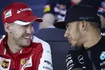 Foto zur News: Sebastian Vettel (Ferrari) und Lewis Hamilton (Mercedes)