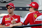Foto zur News: Sebastian Vettel und Kimi Räikkönen (Ferrari)