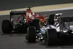 Foto zur News: Sebastian Vettel (Ferrari) und Nico Rosberg (Mercedes)