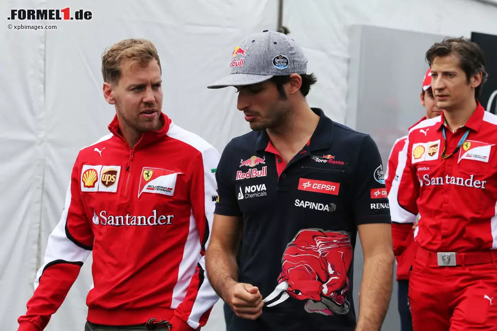 Foto zur News: Sebastian Vettel (Ferrari) und Carlos Sainz (Toro Rosso)