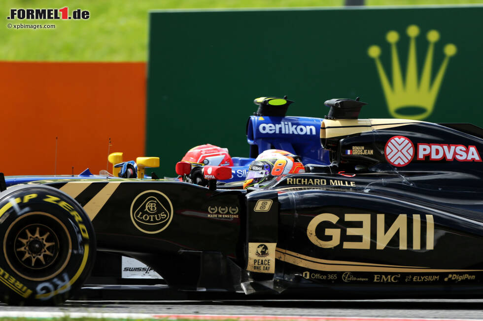 Foto zur News: Romain Grosjean (Lotus) und Felipe Nasr (Sauber)
