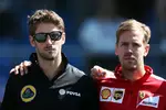 Foto zur News: Romain Grosjean (Lotus), Sebastian Vettel (Ferrari) und Justin Wilson (Andretti)