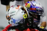 Foto zur News: Sebastian Vettel (Ferrari) und Daniel Ricciardo (Red Bull)