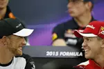 Foto zur News: Jenson Button (McLaren) und Sebastian Vettel (Ferrari)