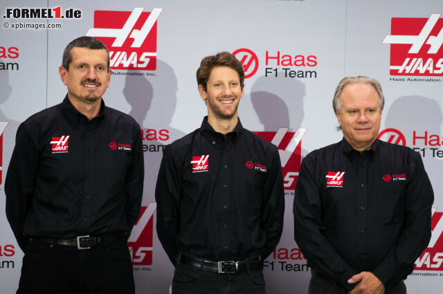 Foto zur News: Teamchef Günther Steiner, Romain Grosjean und Teambesitzer Gene Haas