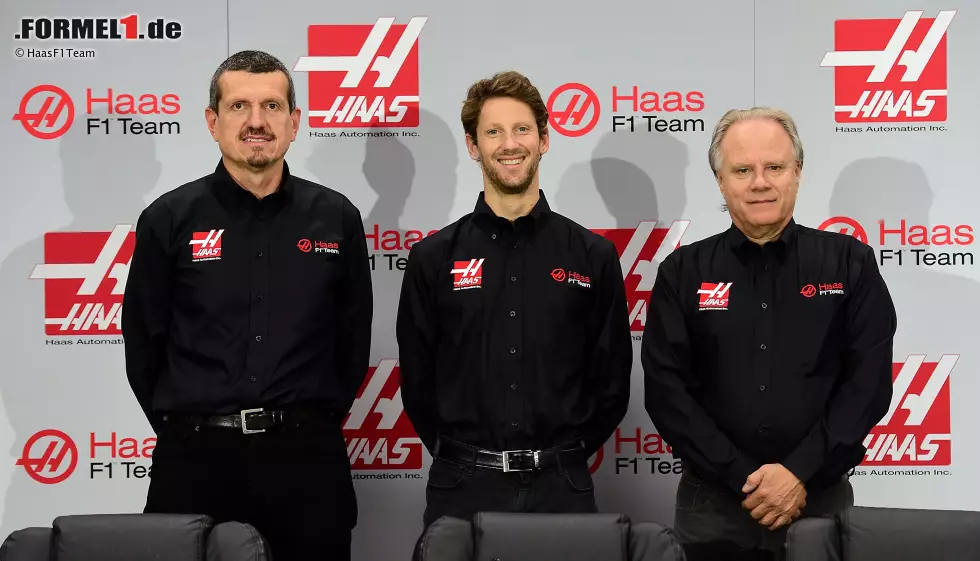 Foto zur News: Teamchef Günther Steiner, Romain Grosjean und Teambesitzer Gene Haas