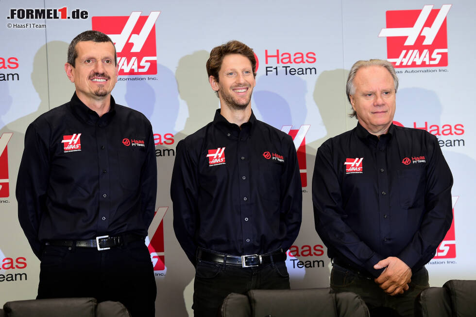 Foto zur News: Teamchef Günther Steiner, Romain Grosjean und Teambesitzer Gene Haas