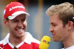 Foto zur News: Sebastian Vettel (Ferrari) und Nico Rosberg (Mercedes)