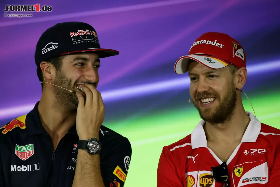 Foto zur News: Daniel Ricciardo (Red Bull) und Sebastian Vettel (Ferrari)