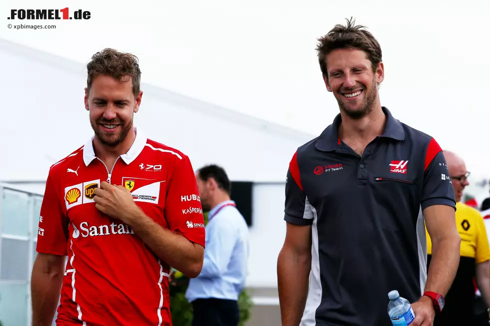 Foto zur News: Sebastian Vettel (Ferrari) und Romain Grosjean (Haas)