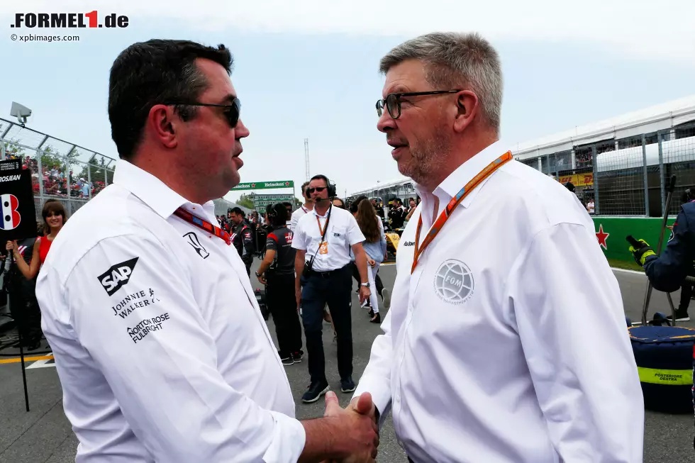 Foto zur News: Eric Boullier und Ross Brawn