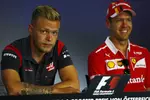 Foto zur News: Kevin Magnussen (Haas) und Sebastian Vettel (Ferrari)