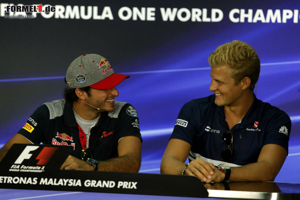 Foto zur News: Carlos Sainz (Toro Rosso) und Marcus Ericsson (Sauber)