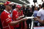 Foto zur News: Sebastian Vettel (Ferrari) und Kimi Räikkönen (Ferrari)