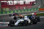 Foto zur News: Lance Stroll (Williams), Romain Grosjean (Haas) und Stoffel Vandoorne (McLaren)