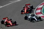 Foto zur News: Kimi Räikkönen (Ferrari), Valtteri Bottas (Mercedes) und Sebastian Vettel (Ferrari)